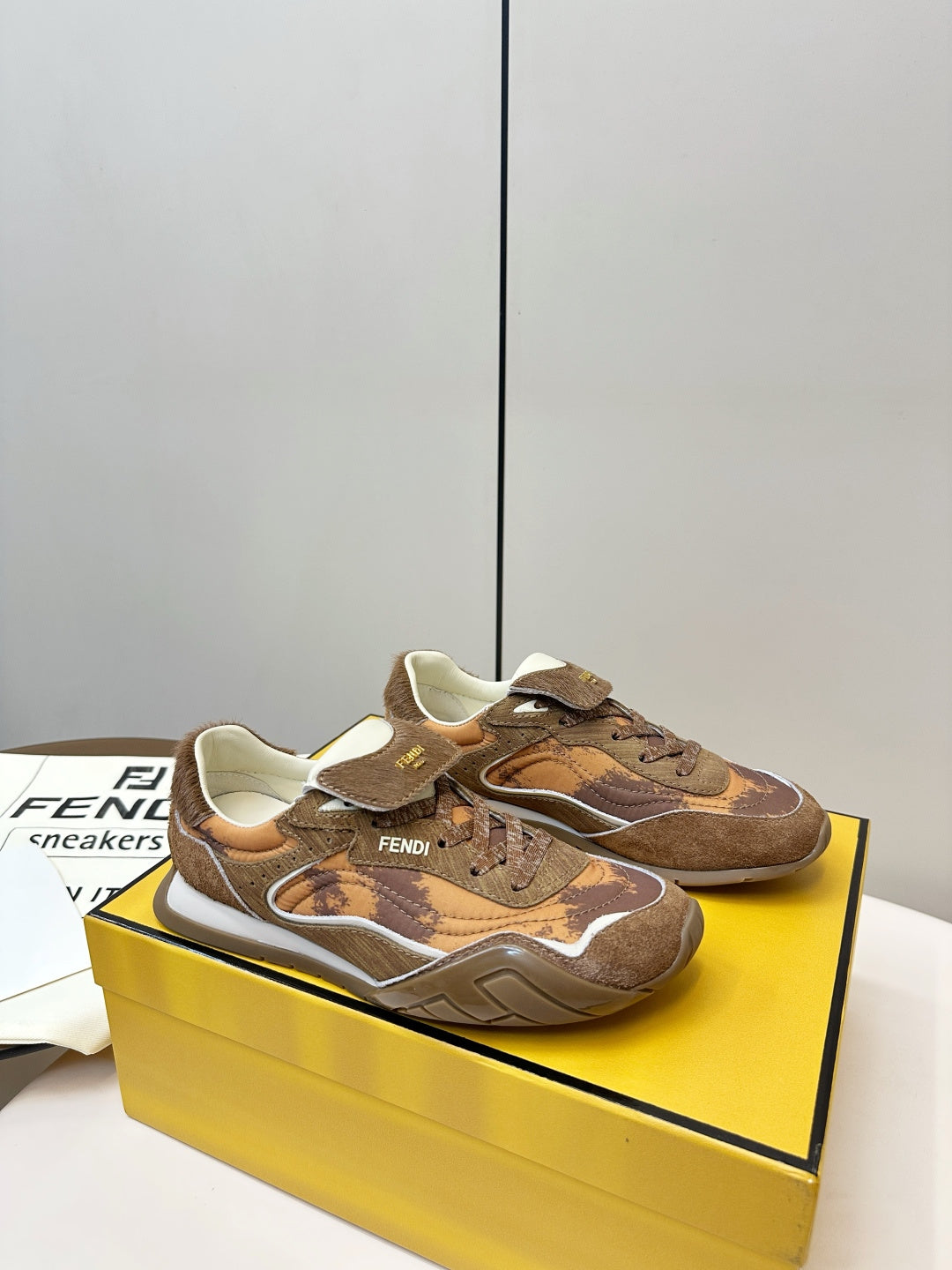 Fendi unisex sneakers in brown, side view with camo-like pattern and thick sole
