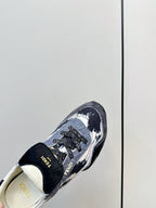 Fendi sneaker toe and lace area with navy and white print and FENDI lettering
