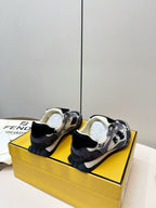 Fendi unisex sneakers from heel view, navy and white uppers with black back tabs