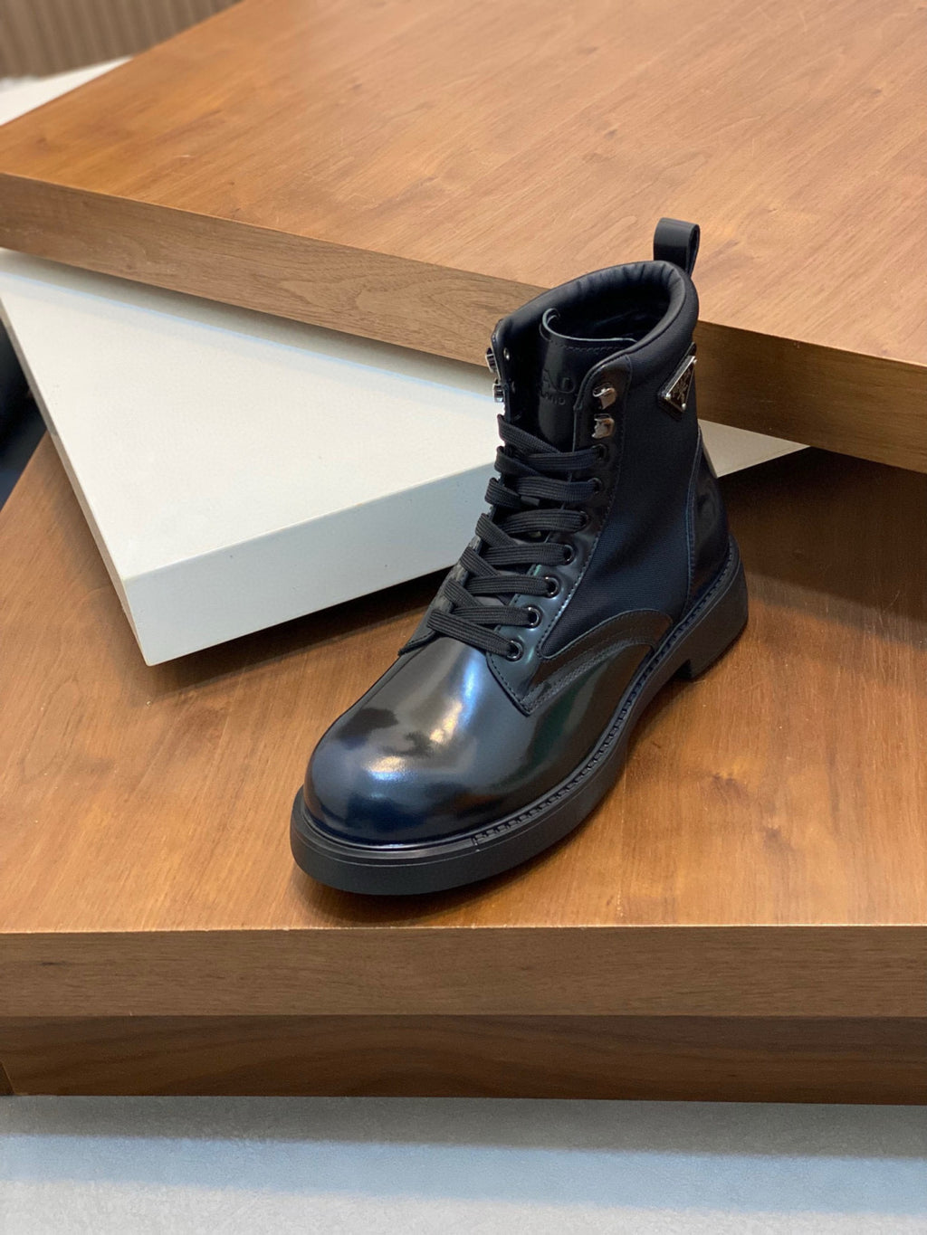 Prada lace-up ankle boots, glossy dark blue leather, padded collar and treaded outsole