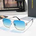 Gold-framed sunglasses with blue gradient lenses and slim metal arms