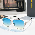 Gold-framed sunglasses with blue gradient lenses and slim metal arms