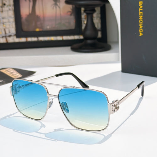 Gold-framed sunglasses with blue gradient lenses and slim metal arms