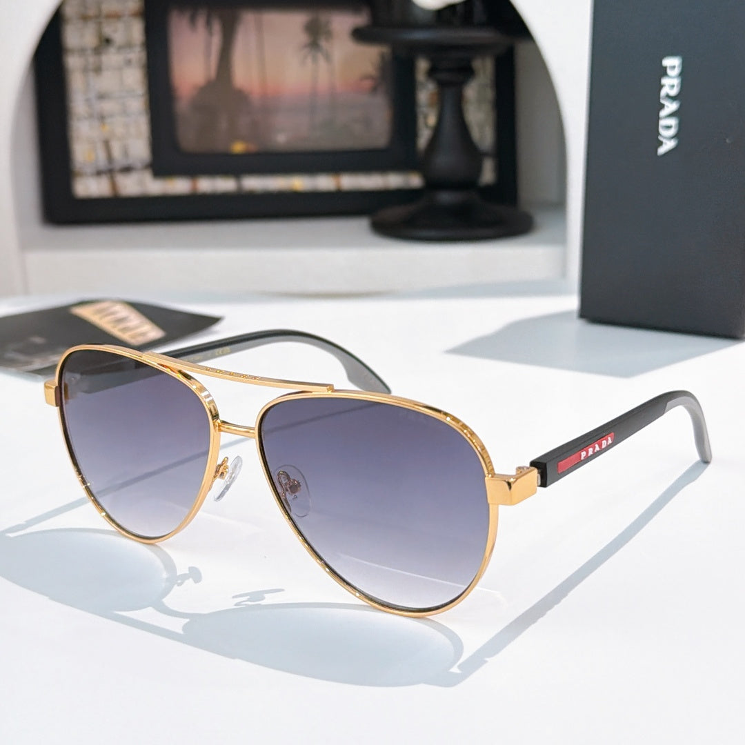 Prada sunglasses with gold frame and purple gradient lenses