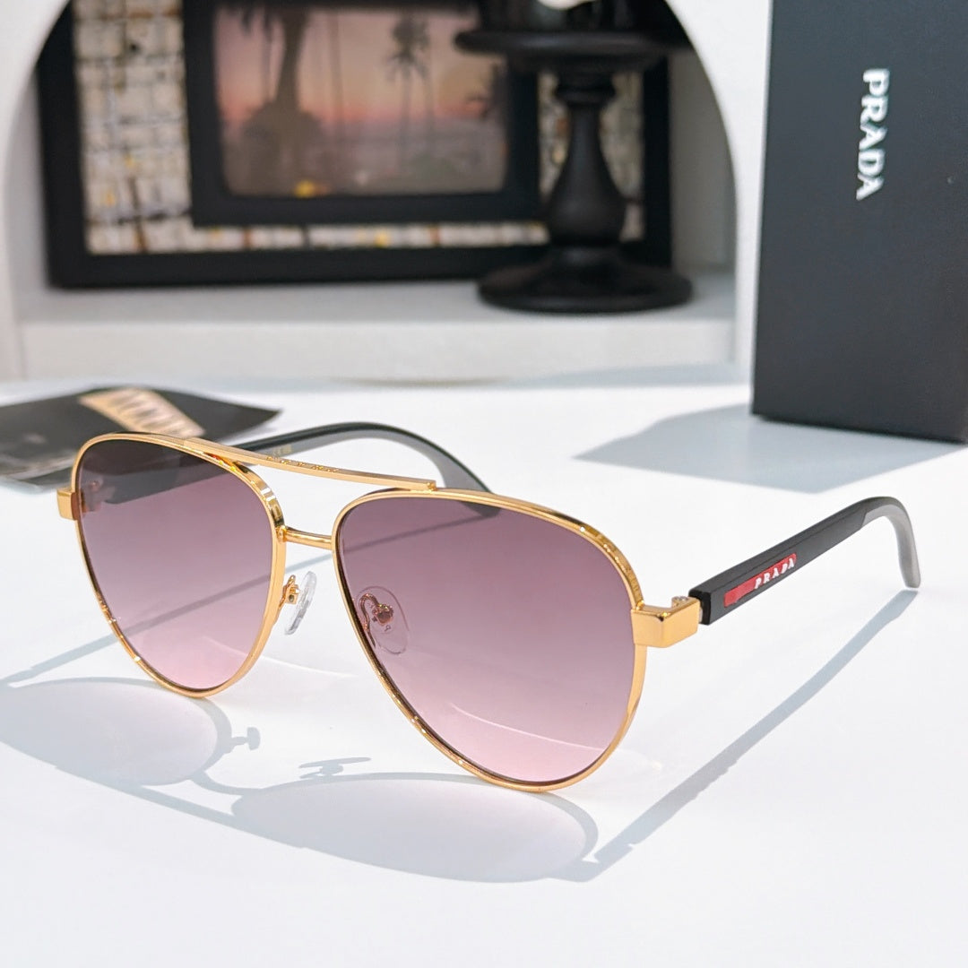 Prada sunglasses with gold frame and pink gradient lenses