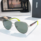 Prada sunglasses with silver frame and green gradient lenses