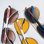Prada sunglasses set with yellow and dark gradient lenses, black and gold frames