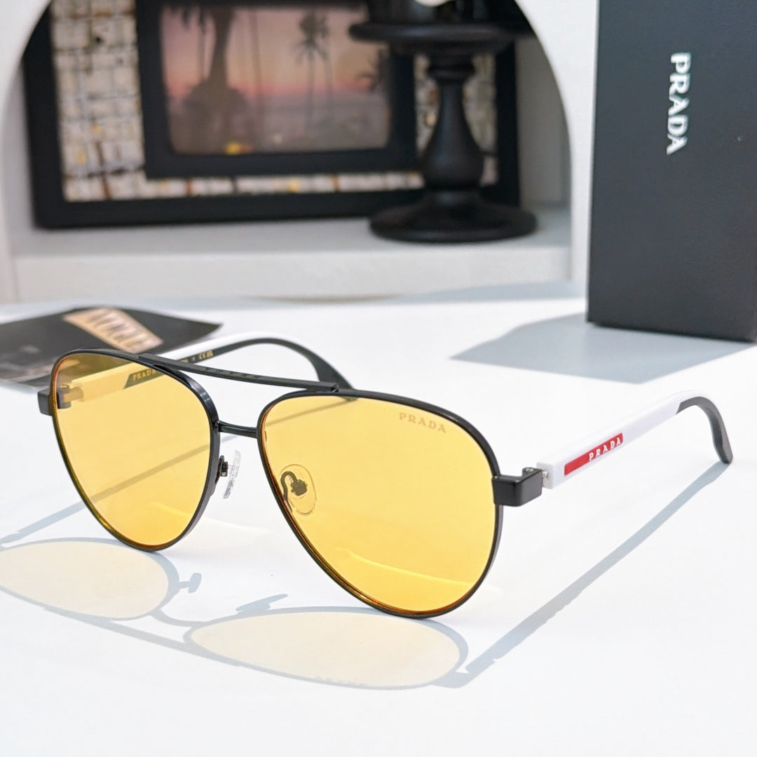 Prada sunglasses with gold frame and yellow gradient lenses