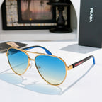 Prada sunglasses with gold frame and blue gradient lenses