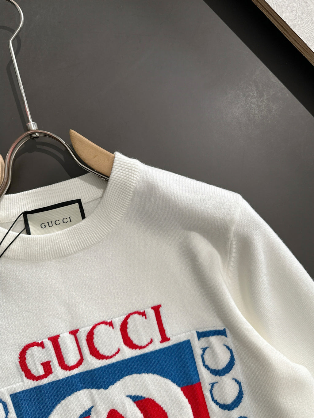 White crewneck sweatshirt with Gucci logo graphic panel at chest, long sleeves