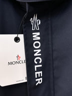Moncler logo patch on navy hooded jacket front