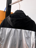 Moncler hooded jacket detail, black hood over silver center panel