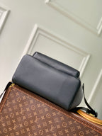 Men's Louis Vuitton leather backpack with top flap and adjustable shoulder strap