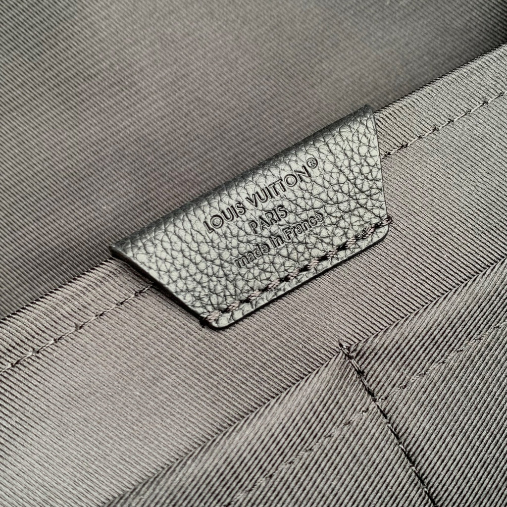 Men's Louis Vuitton leather backpack interior label on gray fabric lining