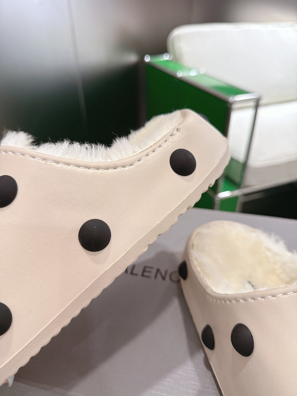 Balenciaga white polka-dot slide sandal, close-up of upper and stitching