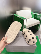 Balenciaga white polka-dot slide sandal, view of textured rubber outsole