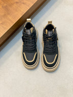 Navy and cream high-top sneaker with Greek-key logo detail on the tongue