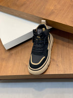 Navy and cream high-top sneakers with lace-up closure and heel tab