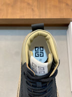 Navy sneaker opening with geometric logo on the tongue and padded light lining