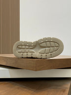 Navy and cream sneaker outsole with tread pattern