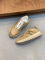 Beige and green suede sneakers with white laces and contrasting panels