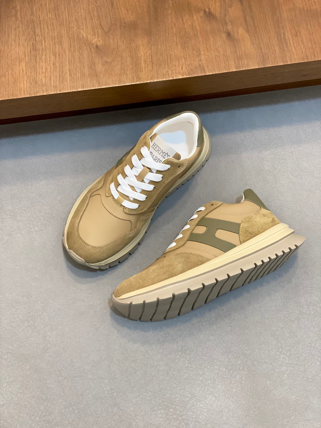 Beige and green suede sneakers with white laces and contrasting panels