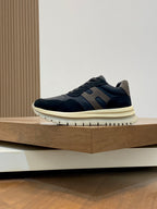 Navy lace-up sneakers with blue side stripes and cream rubber sole