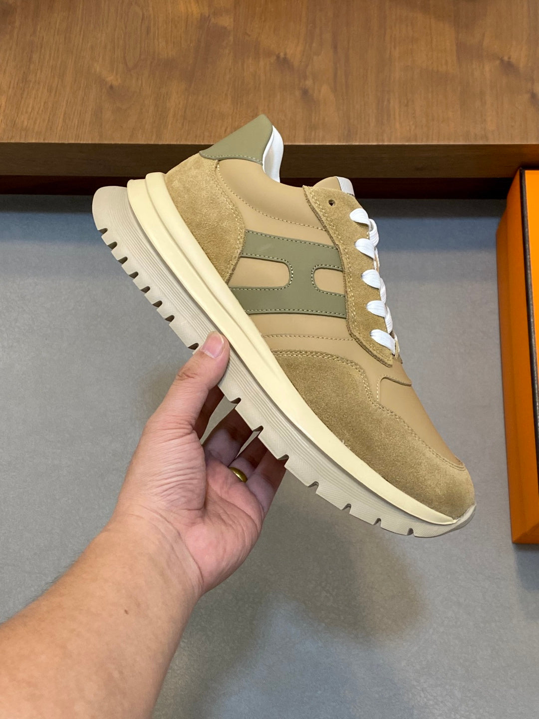 Beige suede sneakers with green inserts and white rubber sole