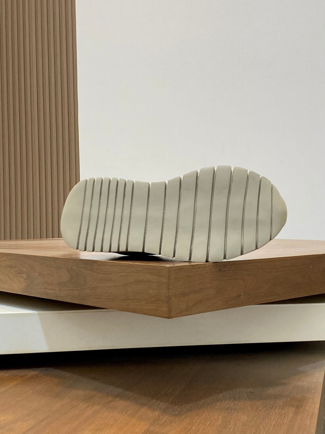Cream rubber sneaker outsole with ridged tread