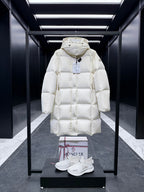 Long quilted puffer coat with hood, light cream, snap-front, long sleeves.