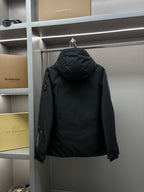 Moncler black long parka back view with attached hood and sleeve zipper pocket