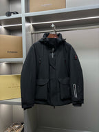 Moncler black long hooded parka with button front and snap pockets