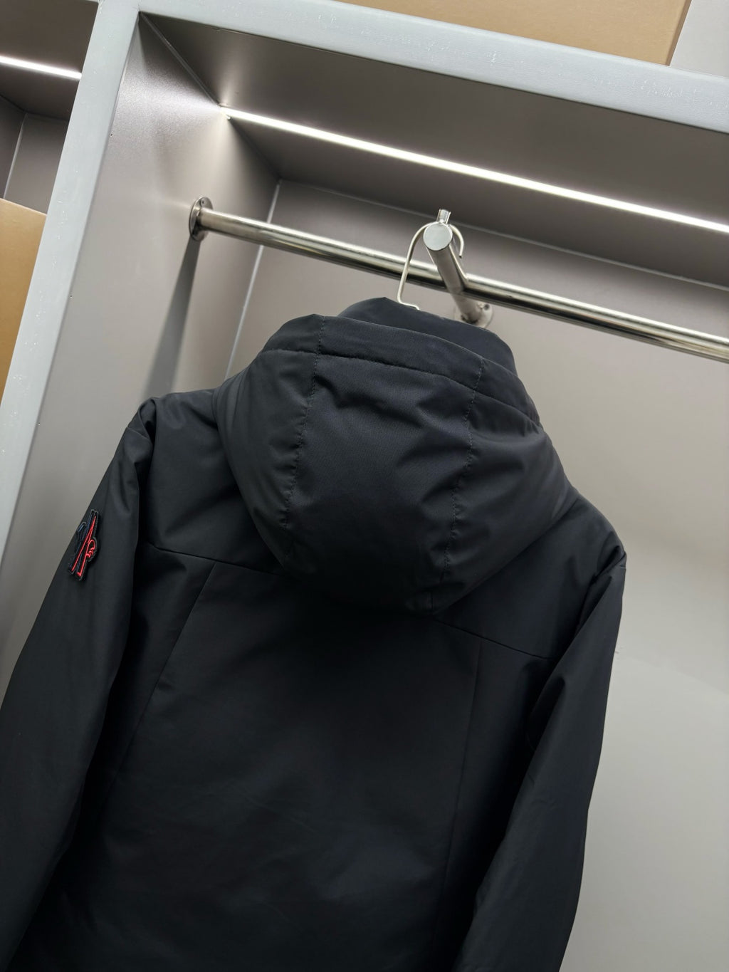 Moncler black long parka hood and back with drawstring and stitched panels