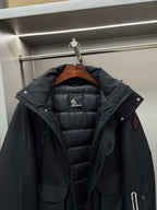 Moncler black long parka with hood and quilted inner lining, buttoned front