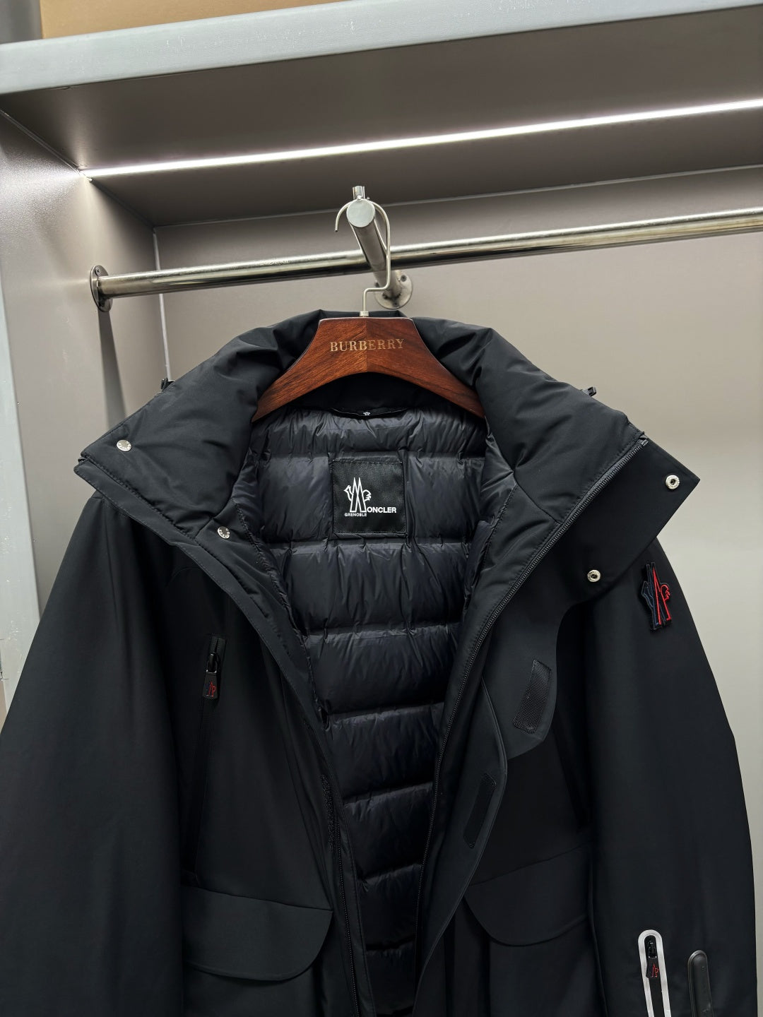 Moncler black long parka with hood and quilted inner lining, buttoned front