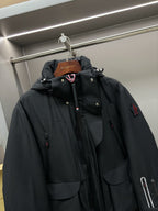 Moncler black long hooded parka with drawstring hood, button front, logo patch