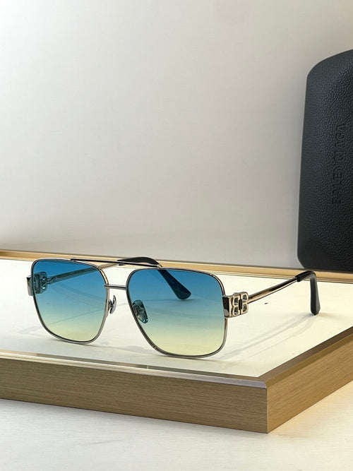 Square gold sunglasses with blue-tinted lenses and black temple tips