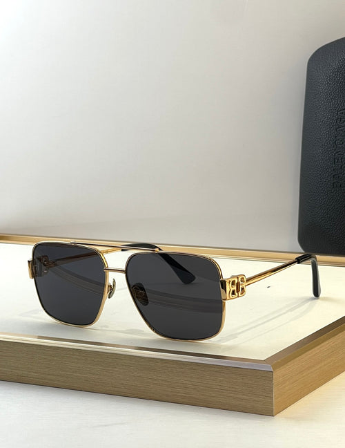 Square gold sunglasses with dark lenses and black temple tips