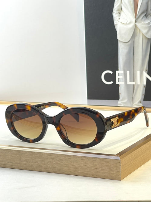 Tortoiseshell round sunglasses with tinted lenses and gold side logo detail