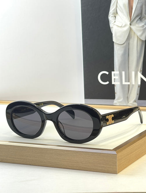 Black round sunglasses with dark lenses and gold side logo detail