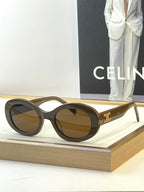 Tortoiseshell round sunglasses with brown-tinted lenses and gold temple logo