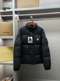 Dark long puffer jacket, full-zip with high collar and chest logo patch