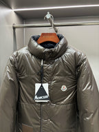 Olive puffer jacket with stand collar, full-zip front and chest logo patch