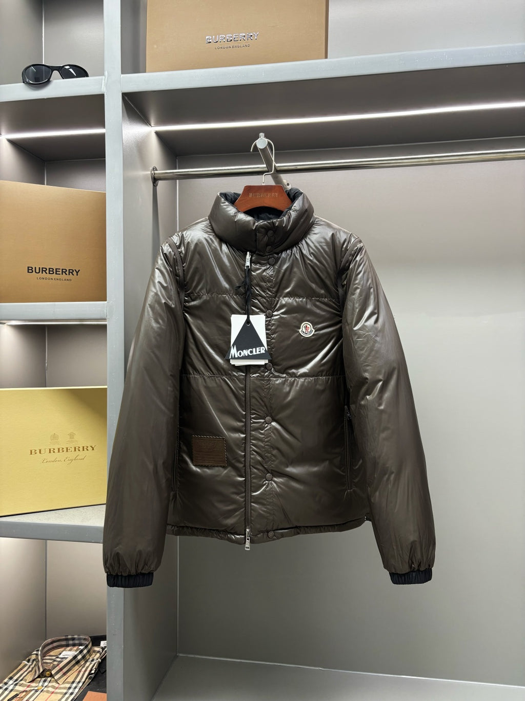 Light gray puffer jacket, full-zip with stand collar and chest logo patch