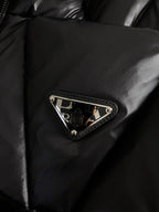 Black puffer jacket chest patch with Prada logo and decorative trim