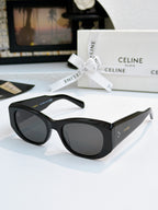 Cat-eye sunglasses with black frames and dark gray lenses.