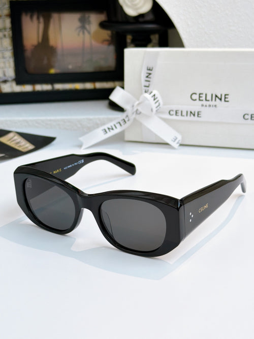 Cat-eye sunglasses with black frames and dark gray lenses.