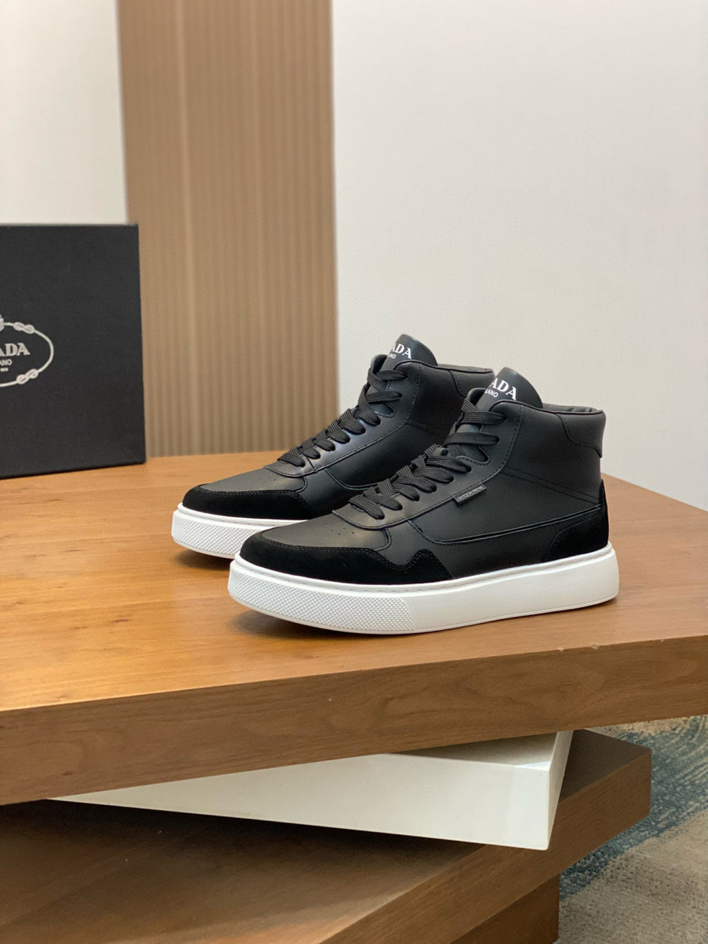 Black leather high-top sneakers, lace-up with padded collar and white sole