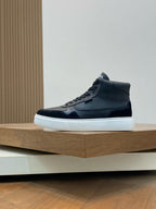 Black high-top sneakers with lace-up closure and white midsole