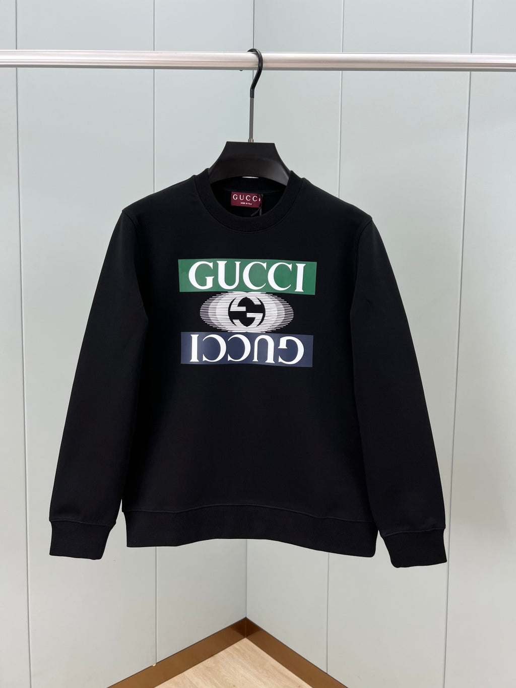 Black crewneck sweatshirt with large Gucci logo graphic on front